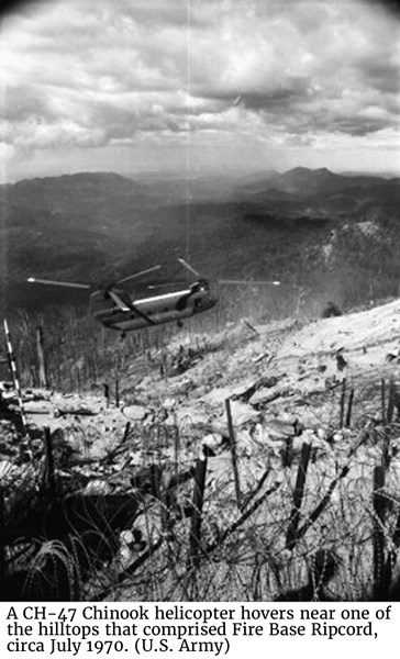 A CH-47 Chinook helicopter hovers near one of the hilltops that comprised Fire Base Ripcord, circa July 1970. (U.S. Army)